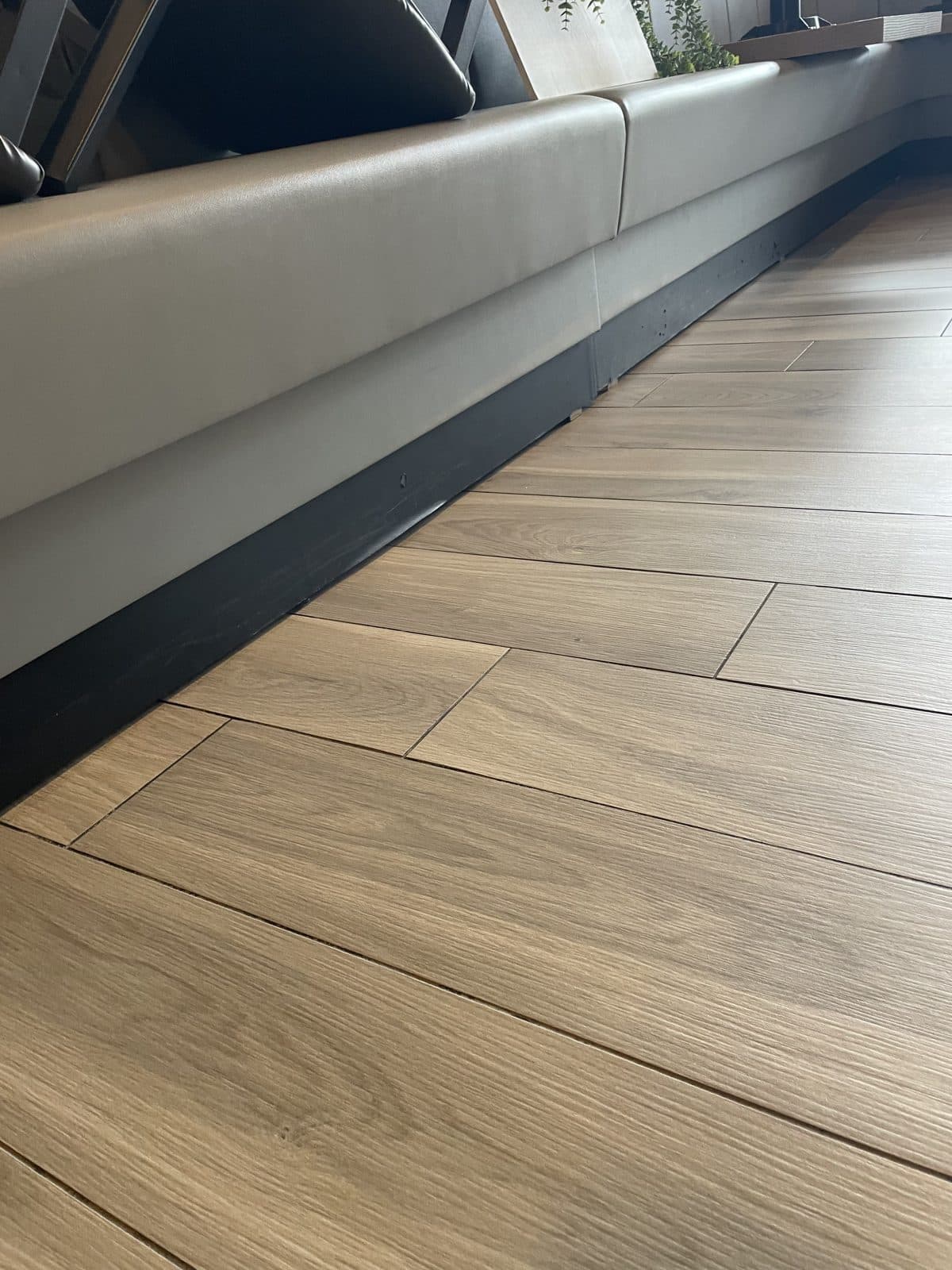 Warm wood-look luxury vinyl plank flooring running the length of a room